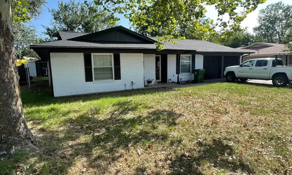 Professional roofing crew working on a residential roof in Felida